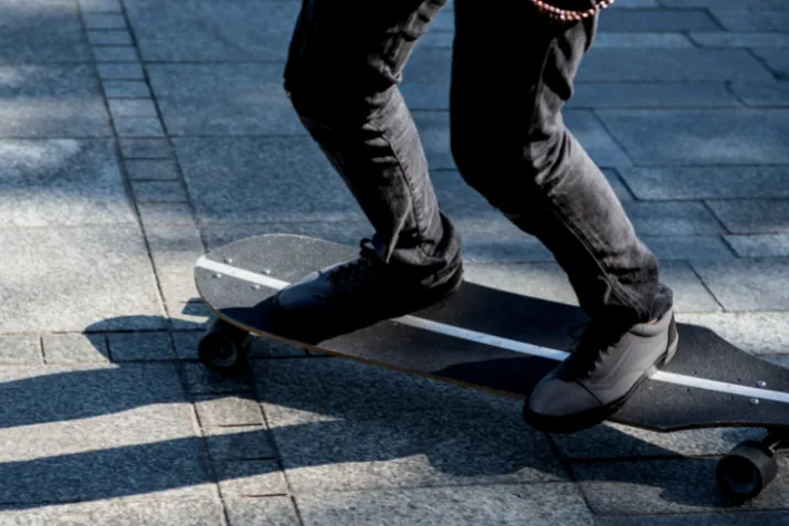 Person riding longboard in different positions